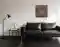 Abstraktes Bild auf Leinwand über einem dunklem Ledersofa. Oxidierte Oxydmischung zeigt das Symbol eines Drachens, wie auf einer alten verrosteten Metallplatte. – Wolfram Schäfers Abstraktes Bild auf Leinwand über einem dunklem Ledersofa. Oxidierte Oxydmischung zeigt das Symbol eines Drachens, wie auf einer alten verrosteten Metallplatte. – Wolfram Schäfers